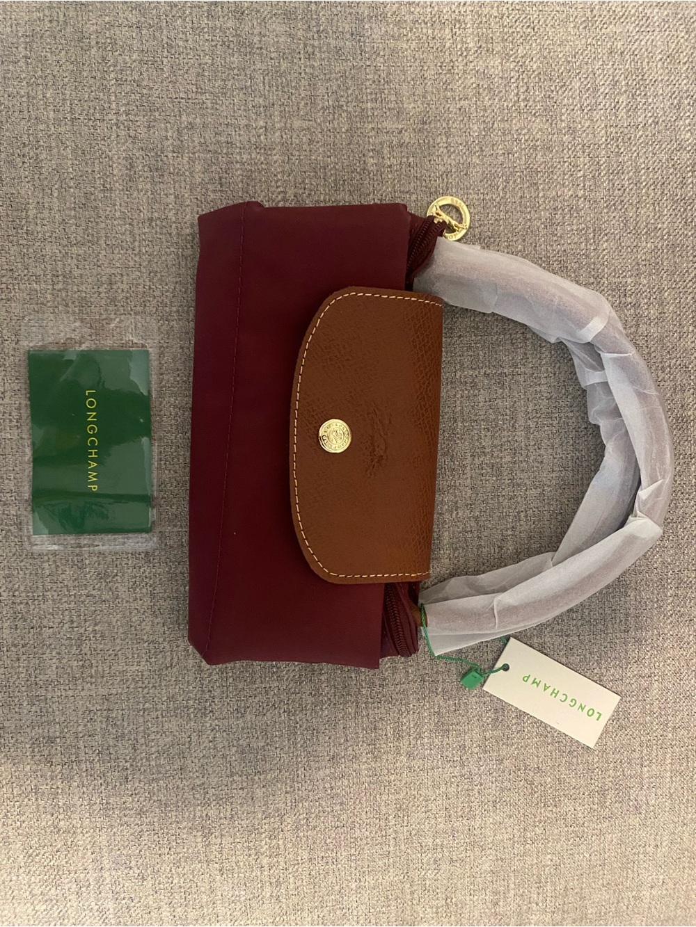 Small le pliage Longchamp burgundy nylon mini bag with brown leather flap